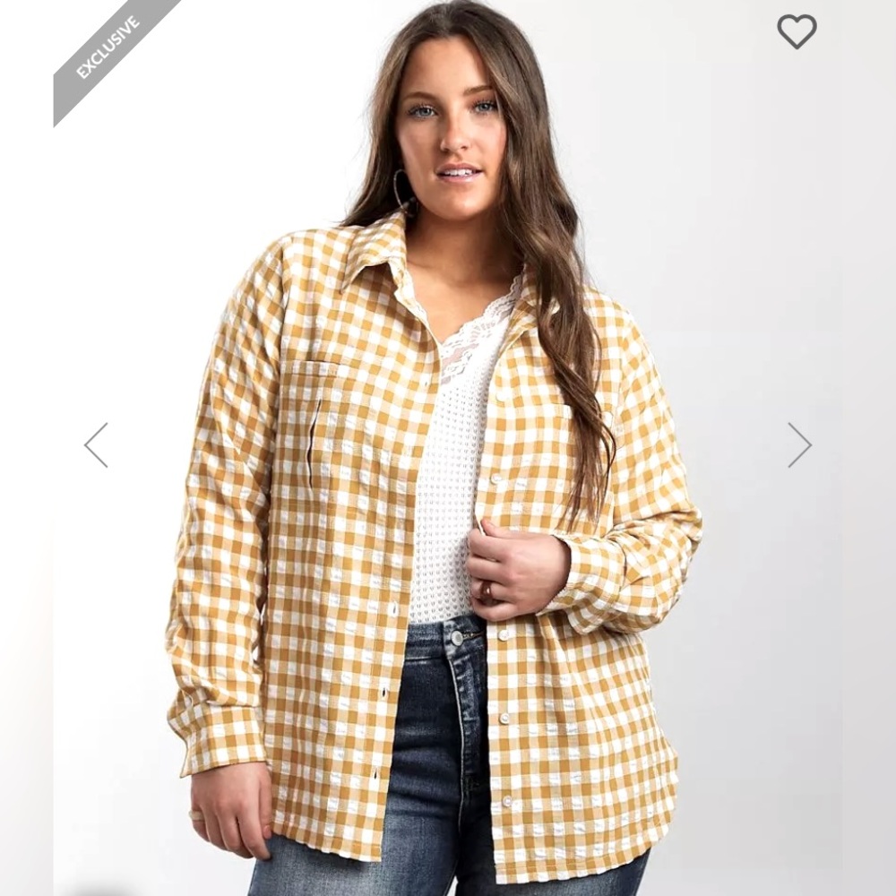 Yellow flannel with a different pattern once sleeves are rolled up.